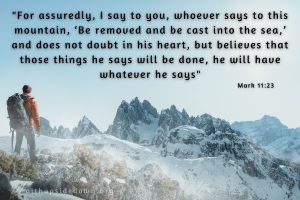 man hiking in winter with snow capped mountains and scripture verse Mark 11_23