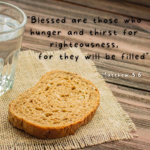 Bread and water on a table and the Bible verse Matther 5:6